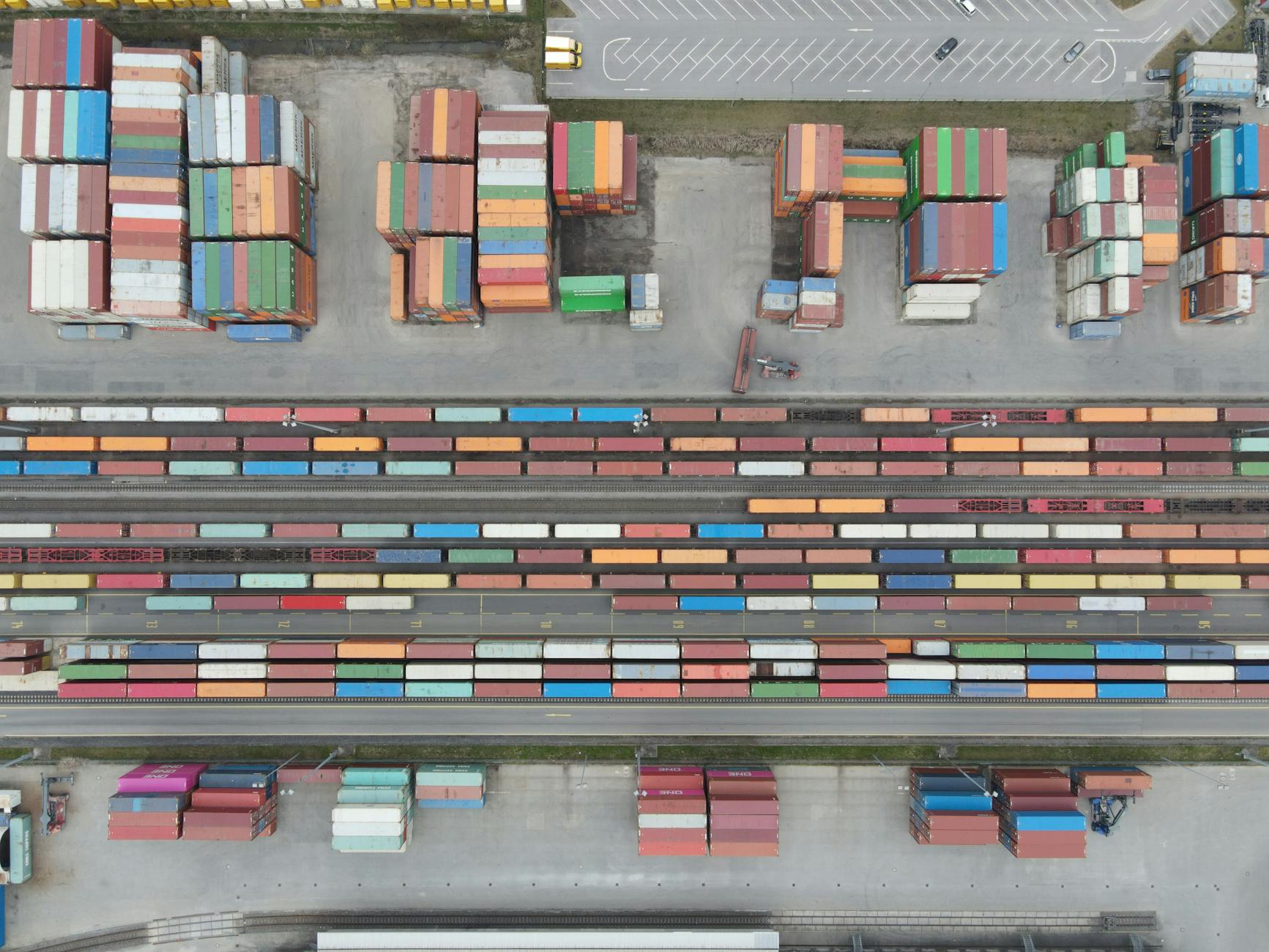 Aerial shot of stacked cargo containers at Regensburg port showcasing freight transport activity.